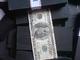 Black notes defaced dollar cleaning white dollar with machine